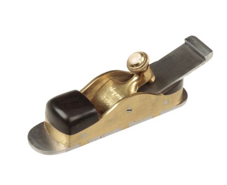 A recent small brass mitre plane with d/t steel sole by SEQUIM TOOLS 5" x 1 1/2" with ebony infill, the knurled brass screw w