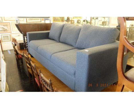 A contemporary three seater sofa, Grey