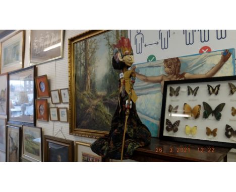 An Indonesian shadow puppet on stand