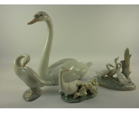 Lladro swan H21cm, two Lladro goose ornaments and a Nao geese group (4)