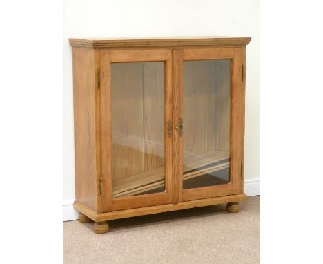 19th century pitch pine cabinet enclosed by two glazed doors, W103cm, H108cm, D35cm Condition Report No shelf supports