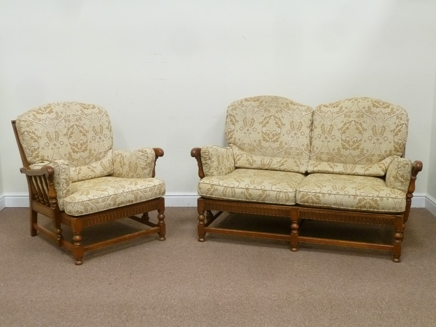 Ercol 'York Minster' golden elm two seat sofa (W154cm), and matching