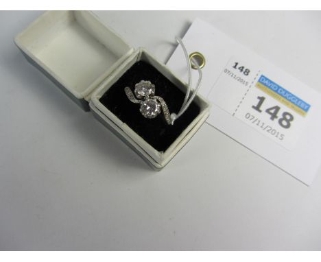 Two stone diamond cross-over ring with diamond shoulders stamped 18ct