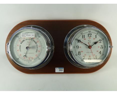 Marine barometer and clock chrome finish mounted on mahogany finish board, W48cm
