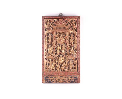 A Chinese Chaozho carved giltwood panel, late Qing, early 20th century, the centre with a deity holding a ruyi and on the bac