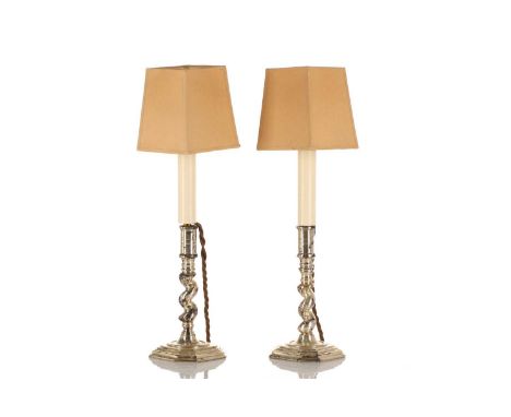 A pair of early 18th-century style silvered metal candlestick table lamps, 20th century, with "Solomonic" columns and over st