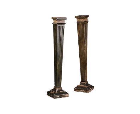 A pair of wooden painted faux marble square section tapering architectural pedestals, early 20th century. With fluted detail 