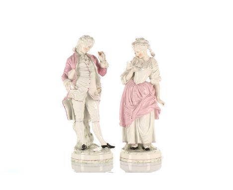 A pair of 19th century large German porcelain figures, in the manner of Helena Wolfshon, a gallant and his mistress, in polyc