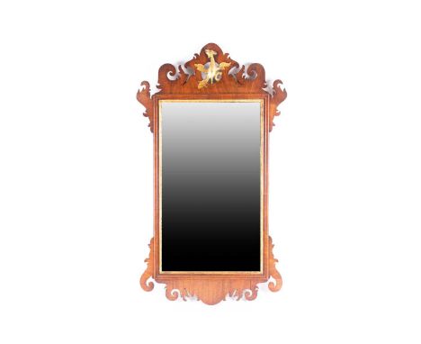 A George III mahogany scroll framed wall mirror, with carved pierced and gilt "HoHo" bird cresting. Fitted a bevelled mirror 