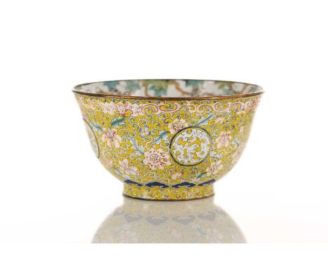 A Chinese Canton enamel bowl with palmettes and scrolling 'Islimi' on a yellow ground, the interior with fruiting vines and a