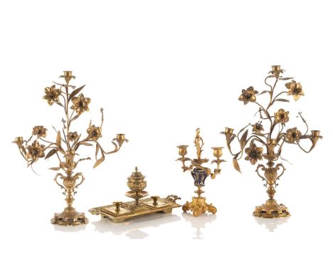 A pair of French ormolu four sconce candelabra,19th century. In the form of trumpet Lillies issued from a pair of two-handled