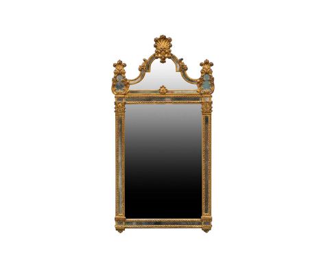 A 'Miror-Belle' gilt-framed Venetian style wall mirror, 20th century, with rococo moulded frame. 126 cm high x 65 cm wideCond
