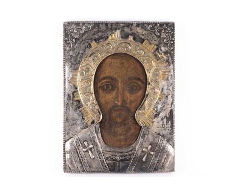 19th century Greek school, a portrait of Christ, tempera on board, with silver and silver gilt oklad, 38 cm x 27.8 cm.Conditi