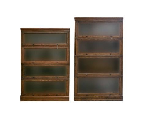 Two Globe Wernicke style stacking oak 'Mevoto' modular four-section bookcases, early 20th century. Each with rising plain gla