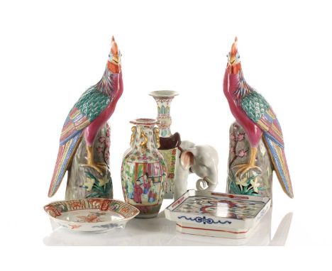 A Pair of Chinese porcelain pheasants, late 20th century, each standing on a pierced rockwork mand flora base, impressed mark