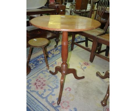 A light Oak circular occasional Table standing on a turned pillar with three splay feet, 21 5/8'' diameter x 28 1/2'' high