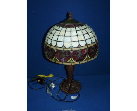 A Tiffany style lamp and glass shade with red hearts, 21" tall.