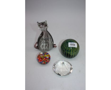 A small quantity of glass paperweights including blue and green Mdina, purple and white stripe cat, 'diamond' shaped paperwei