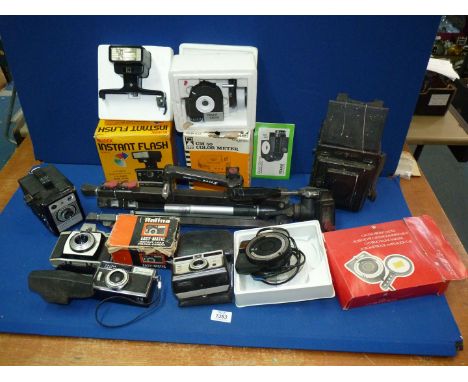 A quantity of cameras and photographic equipment including Kodak Brownie 44A, Halina Easymatic film cameras, Thornton Pickard