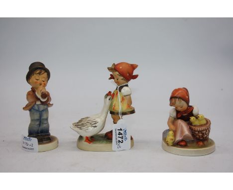A Goebel figure of goose girl, 5" tall and Serenade, 5" tall and a chick girl, 3 1/4" tall.