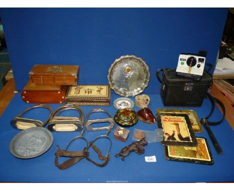 A quantity of miscellanea to include some trinket boxes, one with an Egyptian design, also a Polaroid camera and some stirrup