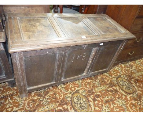 A three panel Oak Coffer/Blanket Chest with scratch moulded details and the carved initials I.B., 50 3/4'' x 23'' deep x 27''