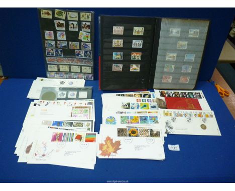 A blue Stockbook with English stamps and quantity of First Day covers including 'Tree and Leaf', 'The 100th Year of The Queen