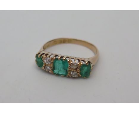 An 18ct Gold Emerald and Diamond Ring, 1.04ct emeralds 