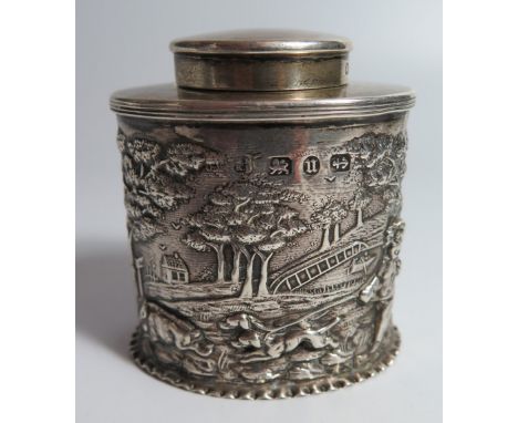 A Victorian Silver Tea Caddy with repousse decoration of putti in landscape hunting boar, Birmingham 1894, George Nathan & Ri
