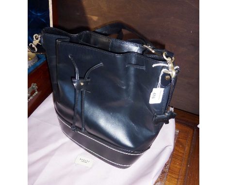 Black Radley bucket bag with protective outer bag. With light signs of use