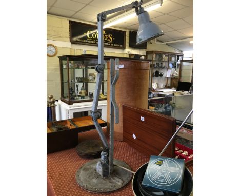 An early 20th century large industrial iron angle poise lamp (overpainted).