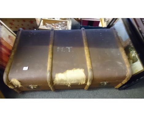 A trunk containing a quantity of vintage clothing.