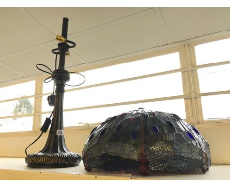 A composition table lamp base with Tiffany style leaded Dragonfly shade.