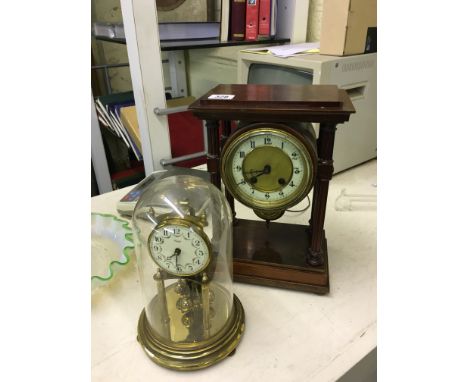A late 19th century open mahogany framed four column mantle clock together with a Kundo brass Anniversary clock under glass d