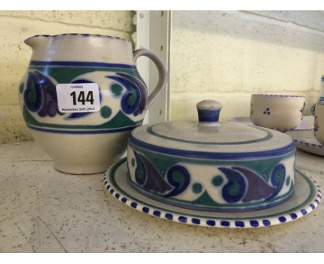 A Poole Pottery crumpet dish, decorated in the OR pattern (badly crazed) together with a red bodied Carter Stabler Adams OR p