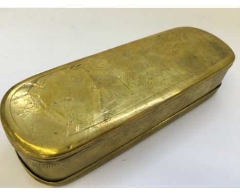 A large Dutch brass rectangular snuff box with rounded corners with engraved figure pictures and inscriptions.
(R6)