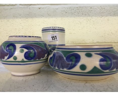 A Poole Pottery vase decorated in the OR pattern together with a small squat vase and a small bowl in the same pattern.