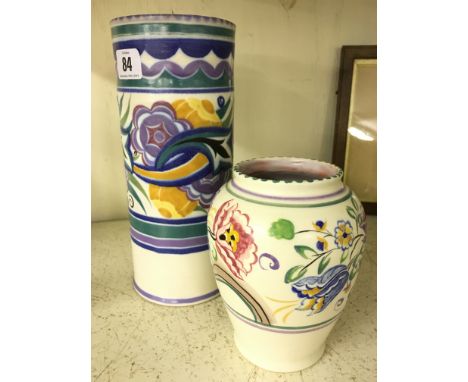 A red bodied Poole Pottery Carter Stabler Adams cylindrical vase decorated in the CO pattern together with an AP pattern vase