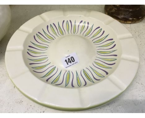 A Poole Pottery Freeform ashtray decorated in the UFW pattern (10 inches).