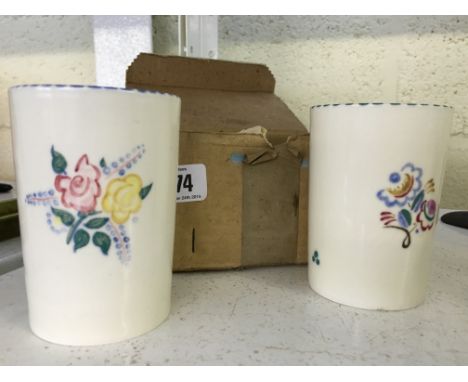 A pair of Poole Pottery beakers, shape 951, decorated in the RD pattern (in original purchase package).