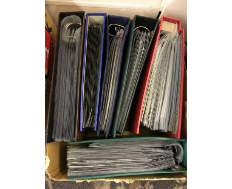 A box containing six albums of First Day Covers.