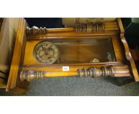 A regulator wall clock.