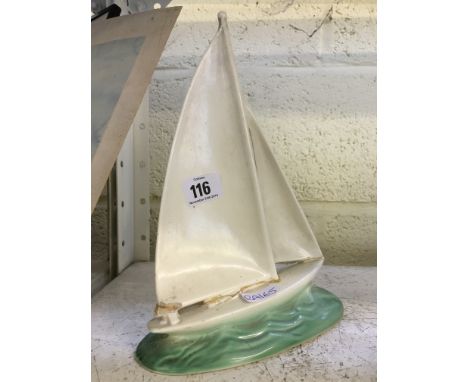 An early 20th century Poole Pottery model of a Racing Yacht (badly af).