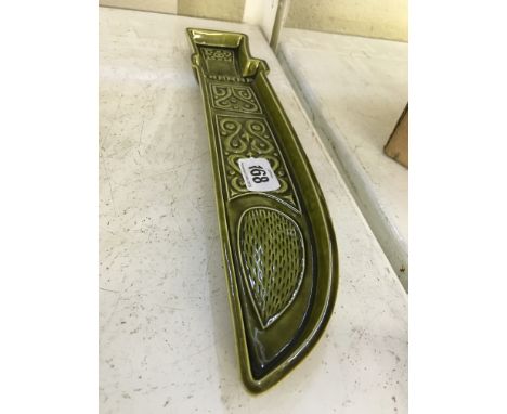 A green glazed Poole Pottery dagger dish designed by Robert Jefferson.