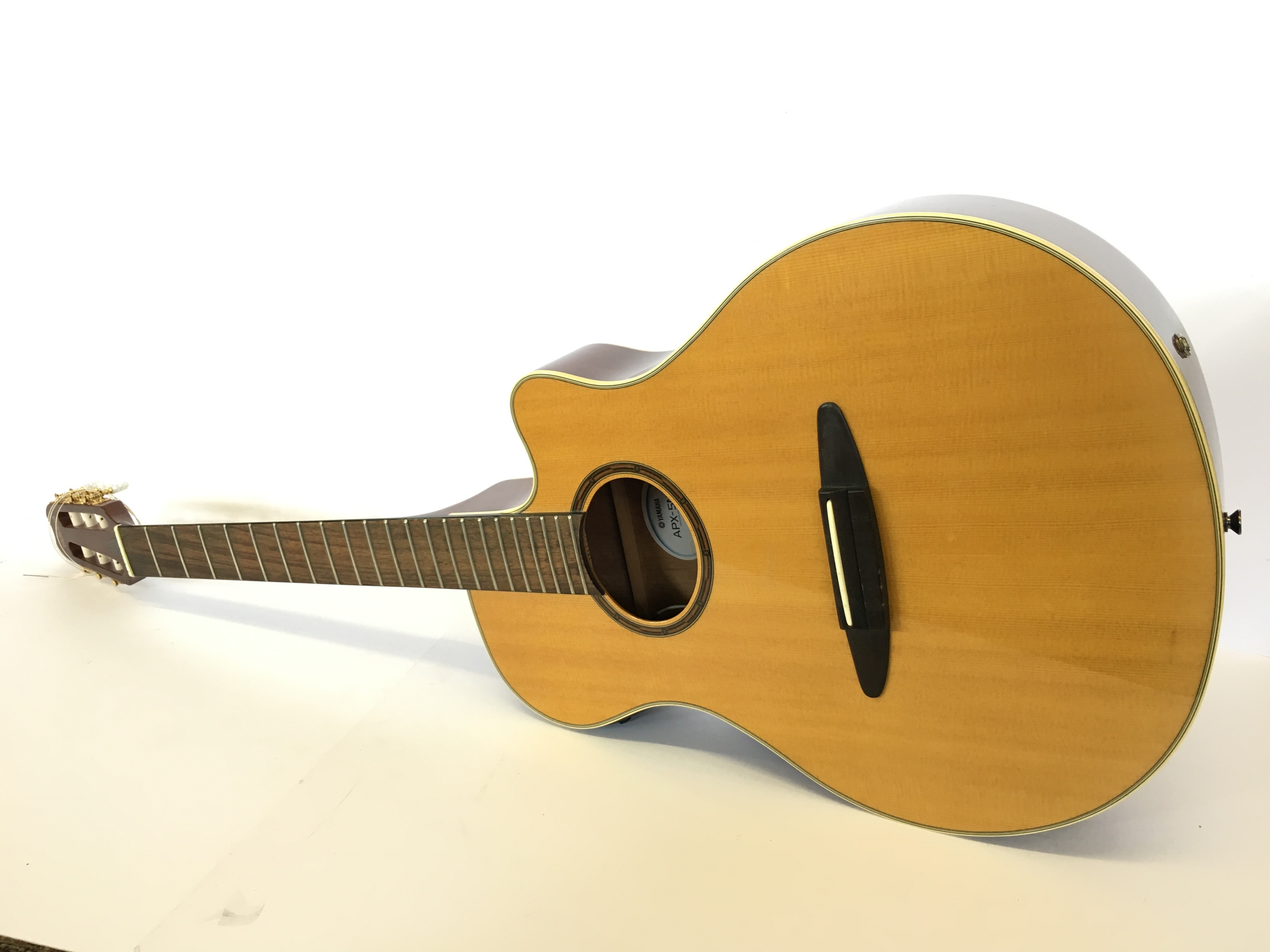 A Yamaha APX5NA six string acoustic guitar (unstrung) with electric