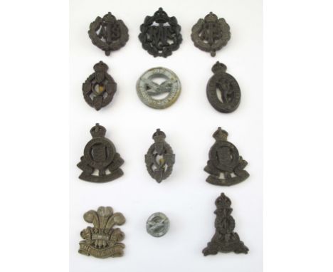 WW2 ECONOMY PLASTIC BRITISH ARMY CAP BADGES Lot of economy plastic WW2 issue cap badges including The Welch Regt (slides abse