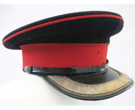 BRITISH ARMY FIELD OFFICERS SERVICE DRESS PEAK CAP  Dark blue hat with scarlet piping and band. Patent leather visor with gol