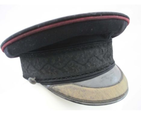 PRE WW1 BRITISH ARMY FIELD OFFICERS DRESS PEAK CAP  Black cloth hat with purple piping and oakleaf band. Patent leather visor