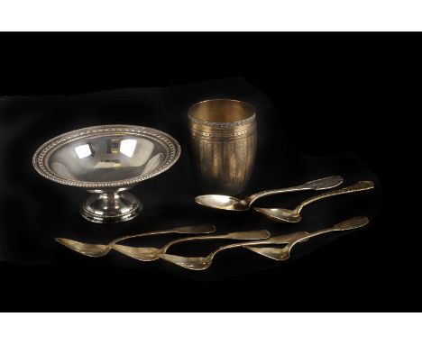 A French silver dice cup, of barrel form, engine turned overall, with a gilt interior, 7cm high, together with a silver foote