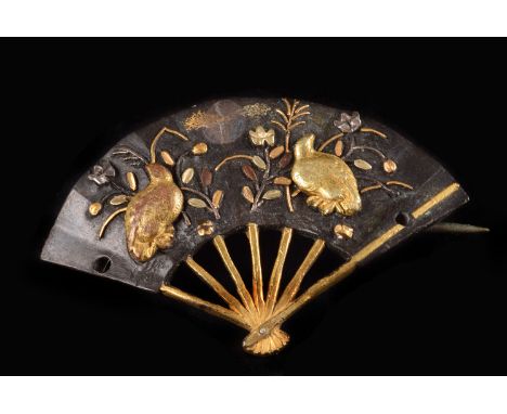 A vintage Japanese Shakudo brooch, in the form of a fan, with two quails and foliage to the leaf and gold inlaid supports